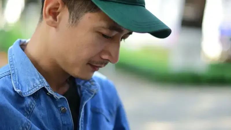 A learner checking a language app outdoors