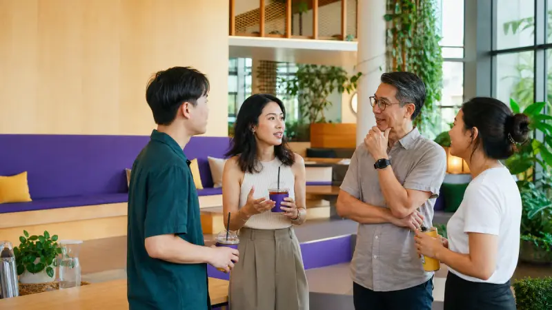 Thai language meetup with speakers of different ages navigating relationship-sensitive conversation